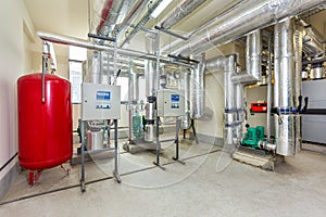 Interior of an industrial boiler room, automatic control panel with many sensors, indicators and valves