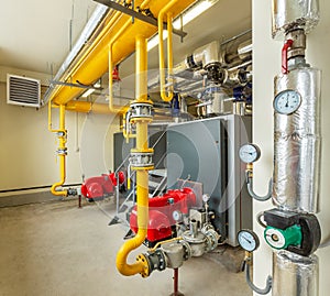 Interior of an industrial gas boiler room with boilers and pipelines