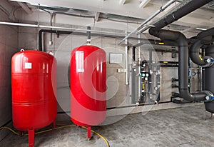 Interior of industrial, gas boiler room with boilers; pumps; sensors and a variety of pipelines