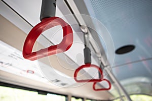 Interior inside of carriage showing drop down handle strap for passengers to hold