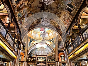 Interior inside the old orthodox Christian church in a Muslim Arab Islamic country with icons, prayers, god murals, ornaments, pai