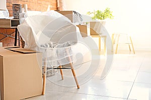 Interior items and packed carton boxes in room. Moving house concept