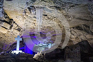 Interior of the Kungur ice cave, Russia. The text on the cross says: save and protec