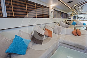 Interior of large salon area of luxury motor yacht