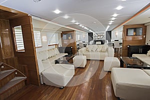 Interior of large salon area of luxury motor yacht