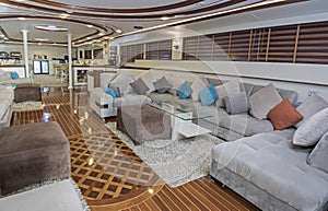 Interior of large salon area of luxury motor yacht