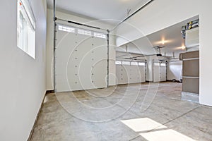 Interior of large three car garage in a brand new house