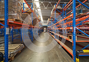 Interior of large warehouse retail store industry. Rack of furniture and home accessories stock storage. Interior of cargo in