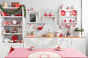 Interior light grey kitchen and red christmas decor. Preparing lunch at home on the kitchen concept.