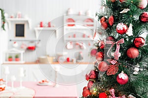 Interior light grey kitchen and red christmas decor. Preparing lunch at home on the kitchen concept.