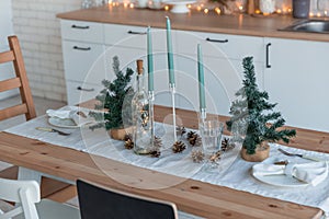 Interior light kitchen with christmas decor and tree