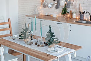 Interior light kitchen with christmas decor and tree