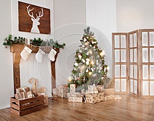 Interior living room with a Christmas tree and gifts.