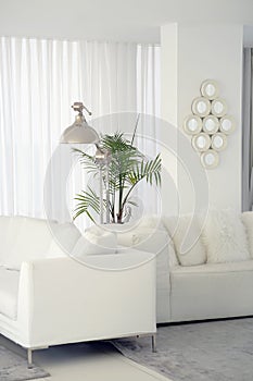 Interior of the living room of the hotel. Beautiful living room with white sofa. White Concept Living Room Interior. Modern bed