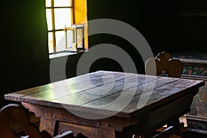 Interior of living room in old traditional rural wooden house.