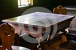 Interior of living room in old traditional rural wooden house.