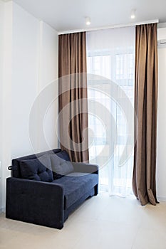 Interior living room with sofa, windows and curtains - copy space