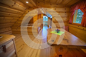 Interior of log cabin accommodation at a glamping site at Lake Bloke in Nova Vas, Slovenia