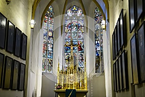 Altar and stained glass window of Lutheran St. Thomas Church Thomaskirche Interior in Leipzig, Germany. November 2019