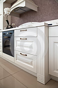 Interior of luxurious modern kitchen white cabinets