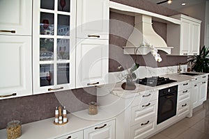 Interior of luxurious modern kitchen white cabinets