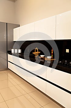 Interior of luxurious modern kitchen white grey cabinets