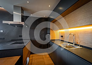 Interior of a luxury black kitchen with appliances