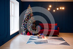 Interior of luxury dark living room with comfortable sofa and modern chandelier decorated with Christmas tree and gifts