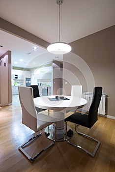 Interior of a luxury dining room with round table and a view to