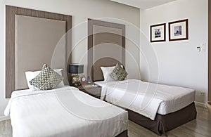 Interior of luxury double beds in hotel bedroom on Mittraphap Road, Nakhon Ratchasima