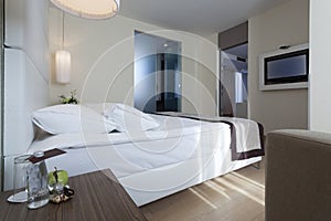 Interior of a luxury hotel bedroom with bathroom