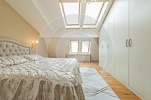 Interior of a luxury loft bedroom with master bed