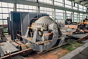 Interior of machinery of abandoned factory of synthetic rubber, rusty eqipment photo