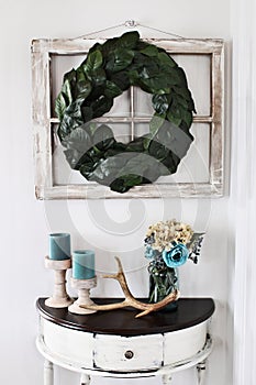 Interior Magnolia Leaf Wreath over Old Window with Table