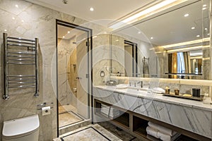 Modern marble bathroom with sink and towel rack