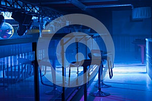 Interior of a modern bar with moody blue lighting