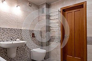 Interior of modern bathroom with bath, shower and toilet.