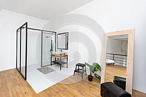 Interior of a modern bathroom with shower cabin