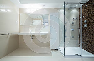 Interior of a modern bathroom with shower cabin