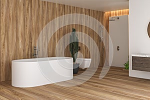 Interior of modern bathroom with white and wooden walls, floor and plants, comfortable white bathtub with faucet,