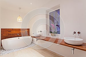 Interior of modern bathroom with window