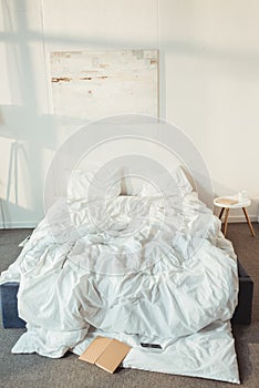 interior of modern bedroom at morning with mess