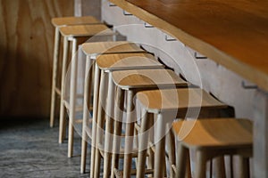Interior of a modern coffee shop with loft style decoration with bamboo chair wooden concrete and steel wood table , copy space