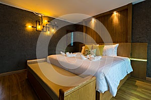 Interior of modern comfortable hotel room. Luxury double bed hotel bedroom interior. Modern master bedroom in a luxury house.