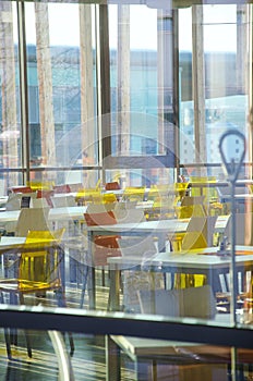 Interior of modern company lunchroom behind window