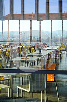 Interior of modern company lunchroom behind window photo