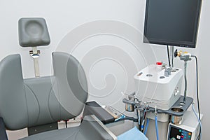 Interior of modern ENT clonic. Professional EVO ENT Medical Devices Workstation and chair in office. Ear Nose and Throat Medical e photo