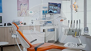 Interior of modern equipped dental orthodontic office with teeth x ray images