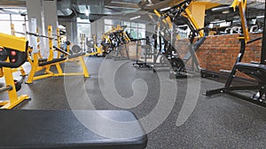 Interior Of Modern Fitness Gym - a lot of modern athletic trainer