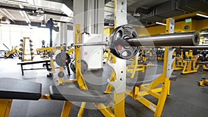 Interior of modern fitness gym - yellow color, slider